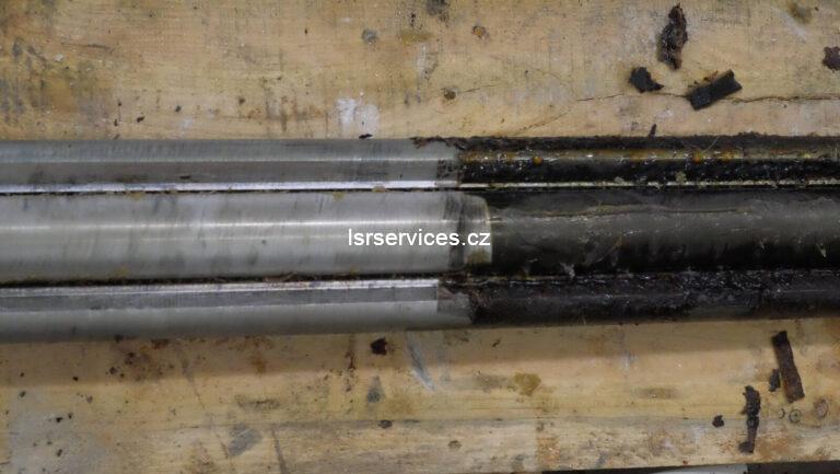 The picture clearly shows the difference between the left part of the cylinder, which has been cleaned and is free of dirt, and the right part, which is covered with adhesives.